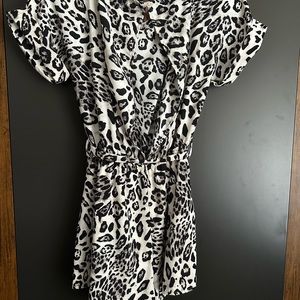 Leopard Romper, black and white, loose fit, lightweight, open in the back.